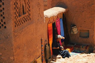 People sitting outside building