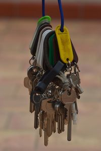 Close-up of key hanging on metal