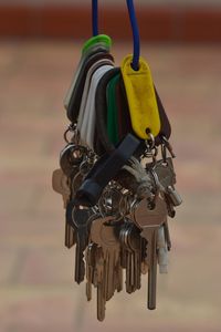 Close-up of keys hanging on wire