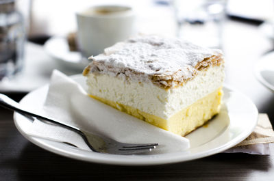 Close-up of cream cake in plate on table