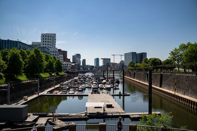 High angle view of river amidst buildings against sky