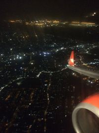 Aerial view of illuminated city at night