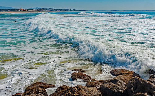 Scenic view of sea shore against sky