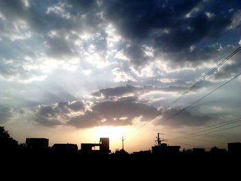 Low angle view of building against cloudy sky