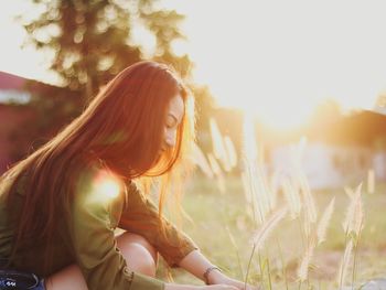 Young woman sitting outdoors