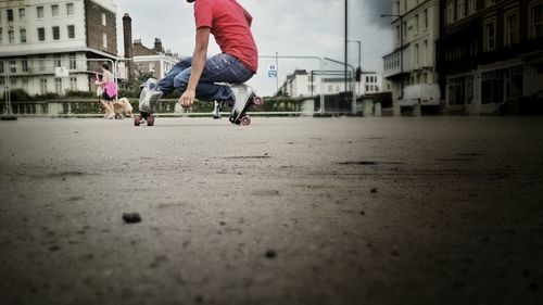 Low section of boy with roller skate on street