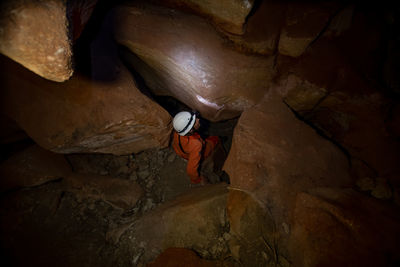 High angle view of man standing on rock