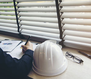 High angle view of man working on table