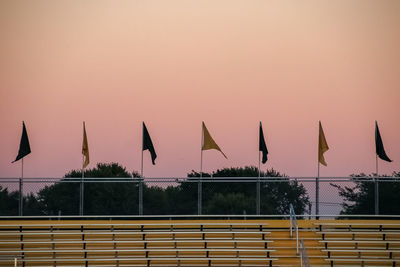 Silhouette built structures against clear sky at sunset