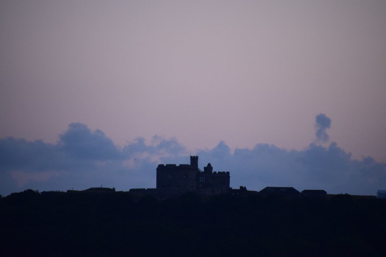 SILHOUETTE BUILDING AGAINST SKY DURING SUNSET