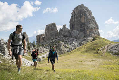 Italy, friends trekking in the dolomtes