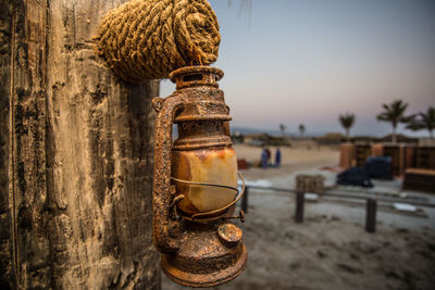 Close up of a rusty oil lamp