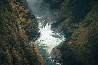 High angle view of river amidst mountains 