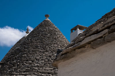 Low angle view of historical building against blue sky