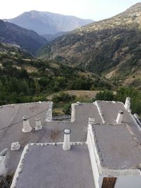 High angle view of road by mountains against sky