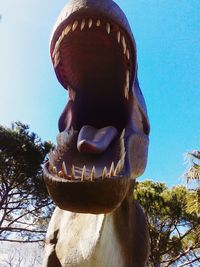Low angle view of statue against sky