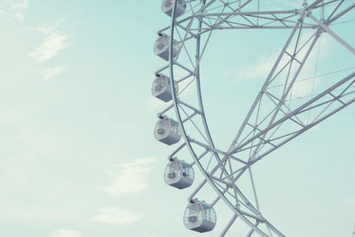 Low angle view of ferris wheel against sky