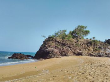 Scenic view of beach against clear sky