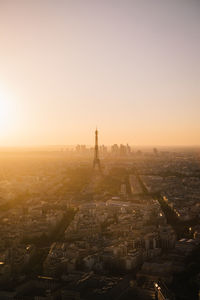 Aerial view of city buildings against clear sky