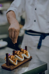 Midsection of man preparing food