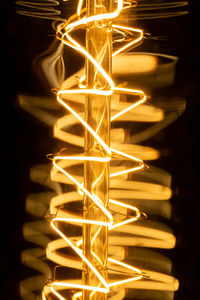 Edison light bulb close up filaments. abstract light background