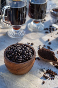 Still life with coffee beans, wooden spoon, making coffee at home