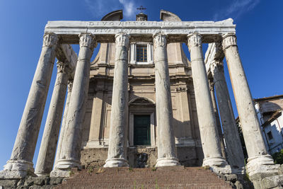 Low angle view of historical building against blue sky