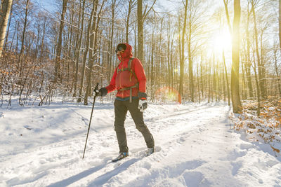 Full length of woman on snow covered field