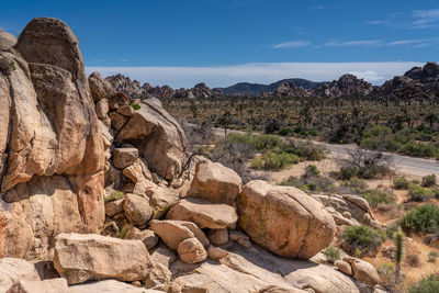 Rock formations on landscape against sky