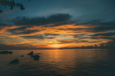 Scenic view of sea against orange sky
