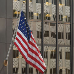 American flag over buildings