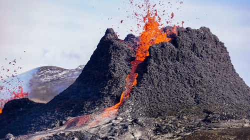 Smoke emitting from volcanic mountain at night