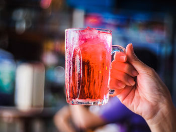 Close-up of hand holding ice cream cone