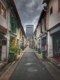 Street amidst buildings in city against sky