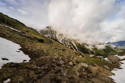 Scenic view of waterfall against sky
