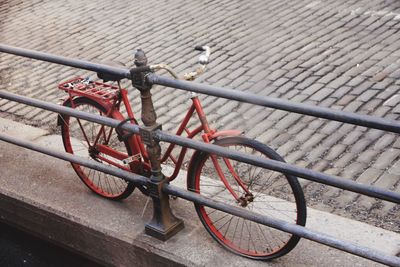Close-up of bicycle on railing