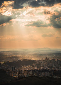 High angle view of buildings against sky during sunset