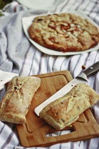 High angle view of bread on cutting board