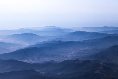 Scenic view of mountains against sky during winter