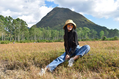 Portrait of man on field against sky