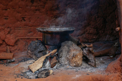 African cooking with firewood and three stones. 