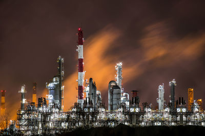 Panoramic view of illuminated buildings against sky at night