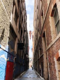 Narrow alley amidst buildings in city