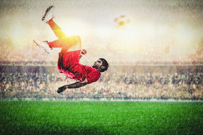 Man playing soccer on field