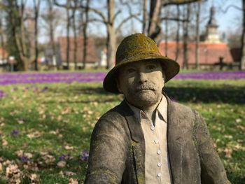 Portrait of man wearing hat on field