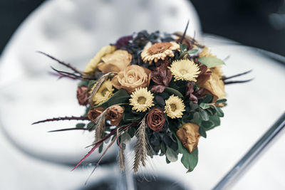 Close-up of wilted flower on table