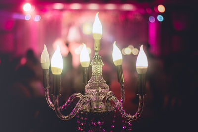 Close-up of illuminated lamp hanging at night