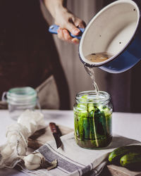 Midsection of person preparing food on table