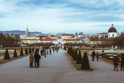 Group of people in front of buildings in city