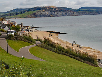 High angle view of sea and buildings against sky